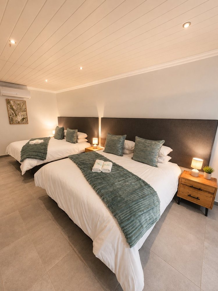 Room 4, two double beds side by side